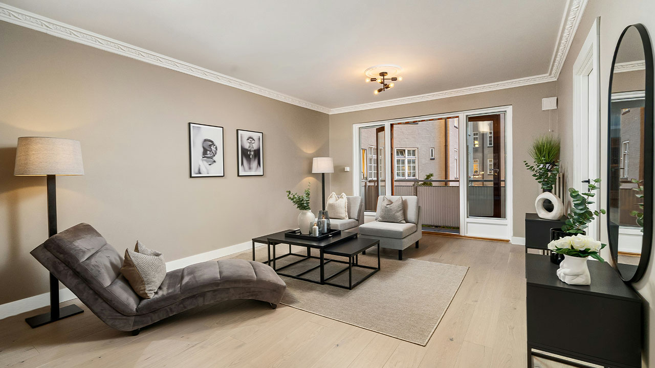 A living room filled with furniture and a large mirror
