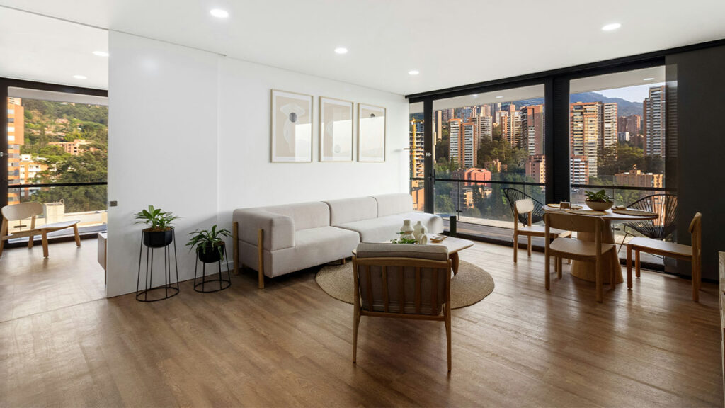 A living room filled with furniture and a large window