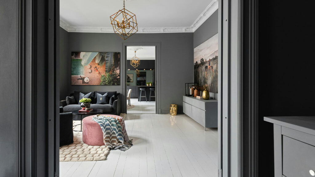 A living room with a couch and a chandelier