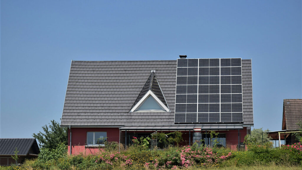 a house with a solar panel on the roof