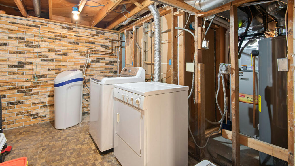 White Top Load Washing Machine and Dryer Inside the Room