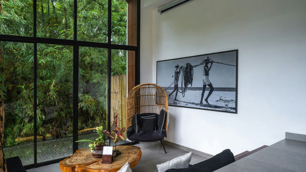 A room with a large window and a wooden table