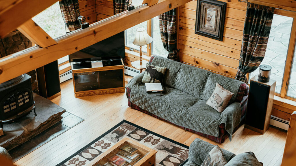 a living room with a couch and a fireplace