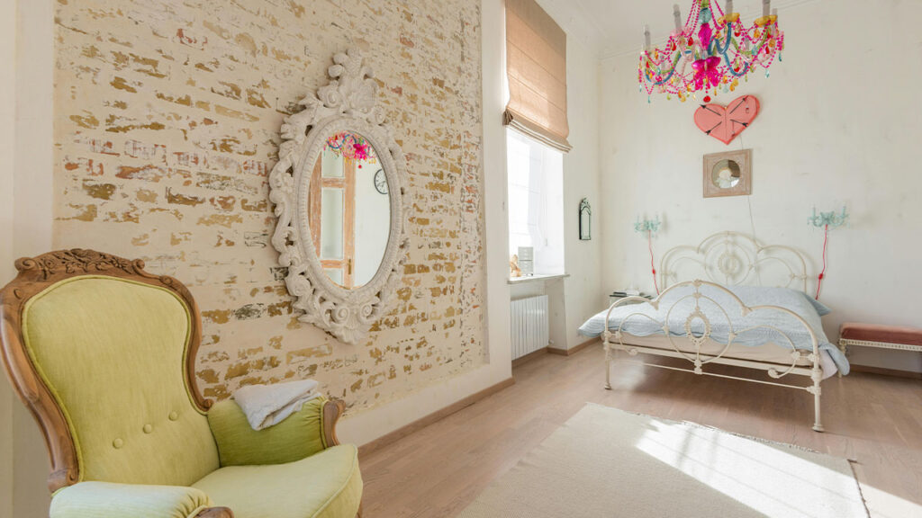 Chandelier and Bed in Room