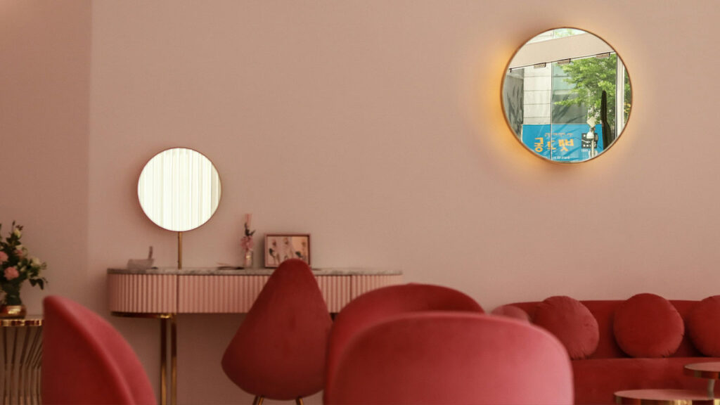 red sofa near round mirror