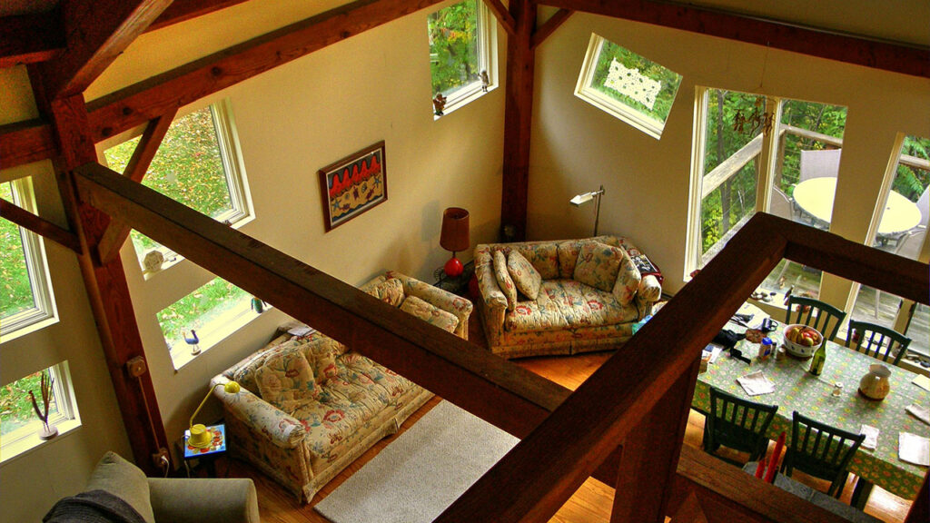 brown padded loveseat near balcony