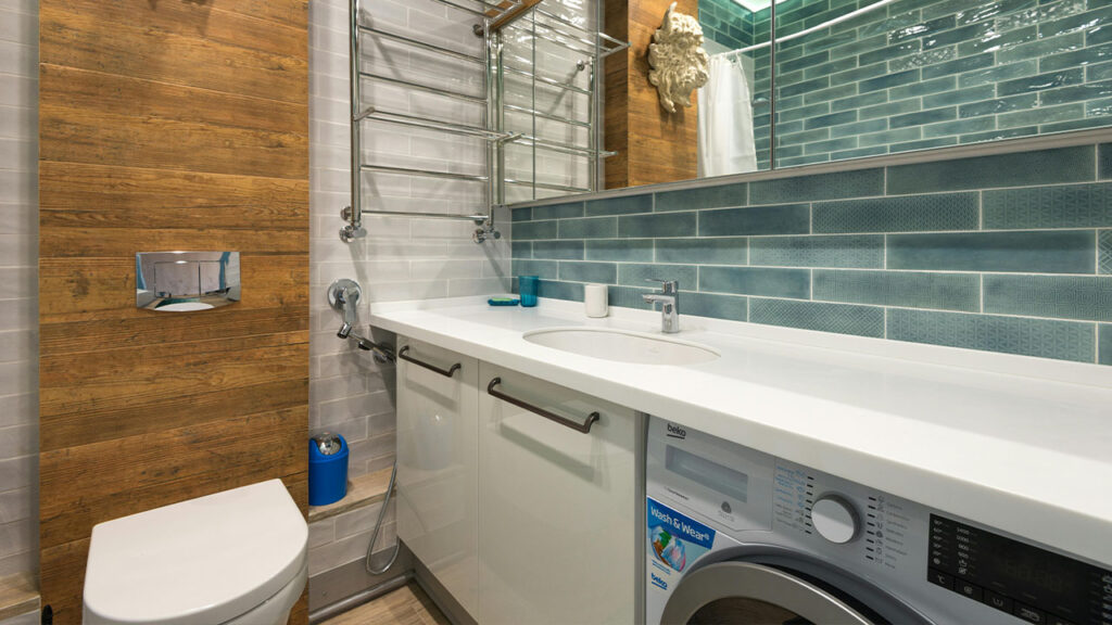 Green Wall Tiles with White Counter Top Bathroom