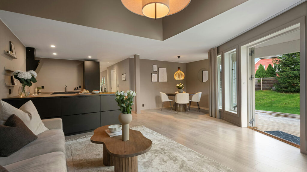 A living room filled with furniture and a large window