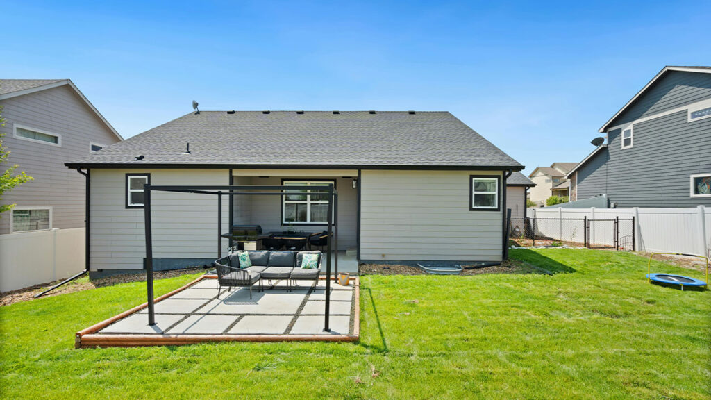 Residential House with a Patio in the Backyard