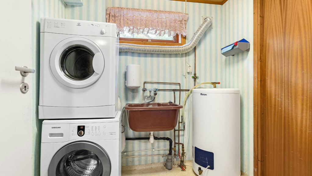 A washer and dryer in a small room
