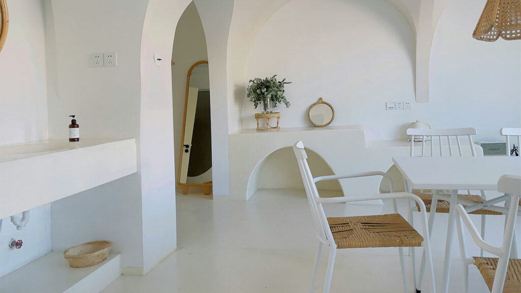 white chairs and table in white room