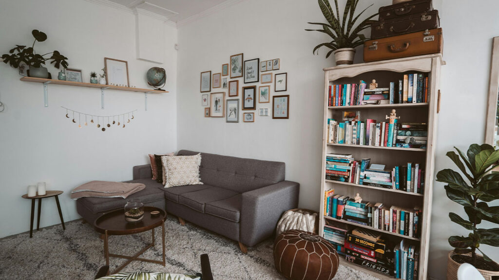 Photo Of Bookshelves Near Grey Couch