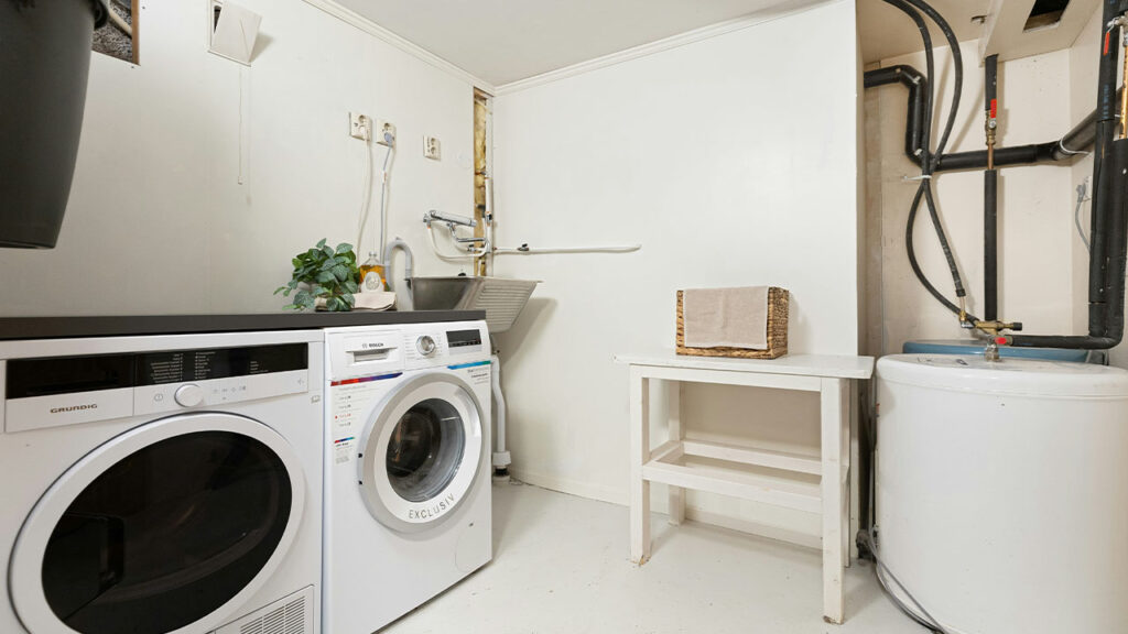 A laundry room with a washer and dryer