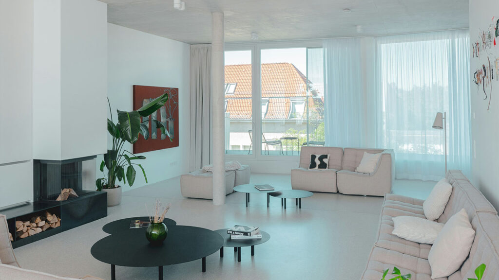 A living room filled with furniture and a fire place