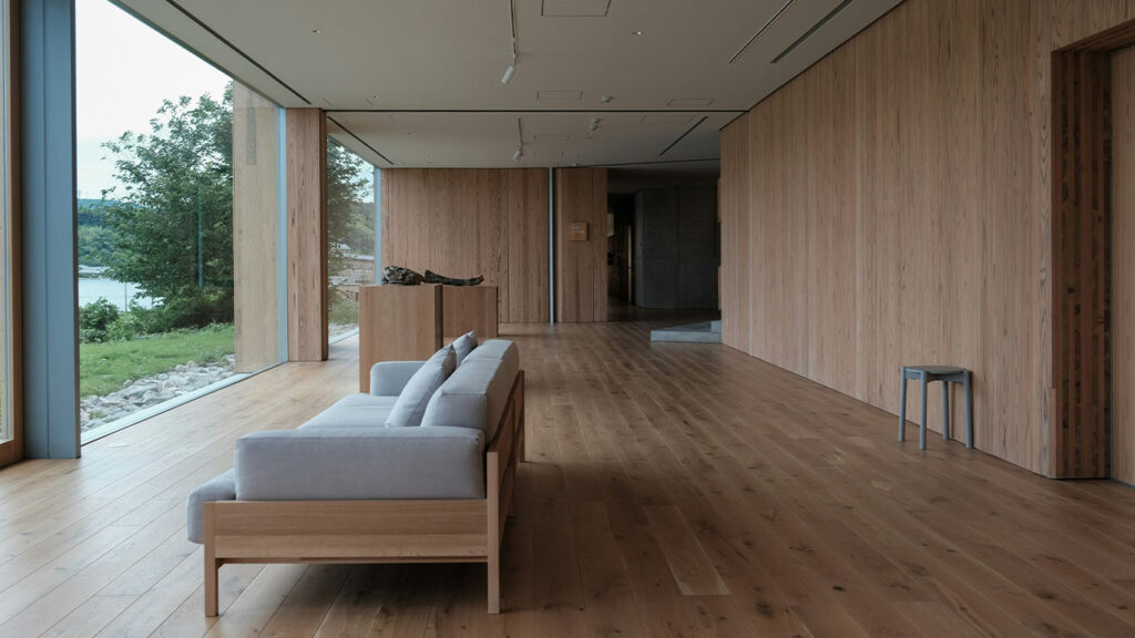 white couch on brown wooden floor