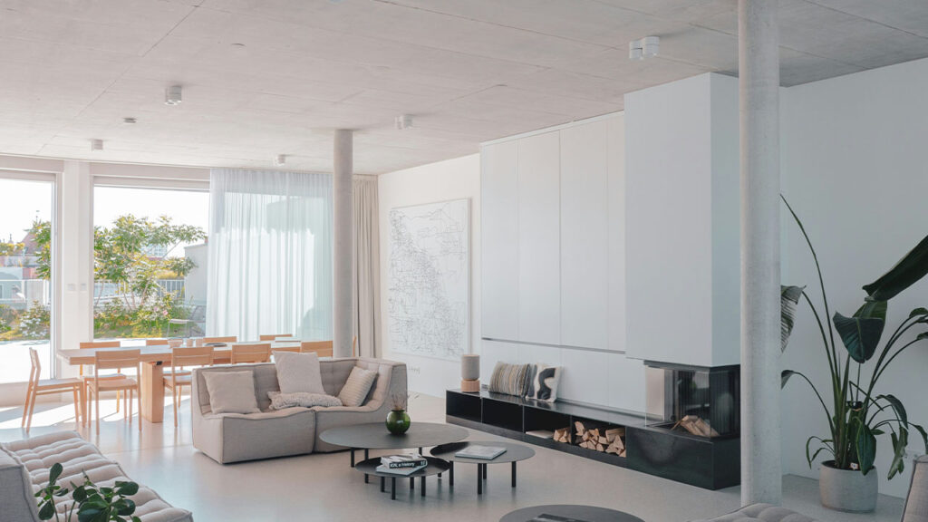 A living room filled with furniture and a fire place