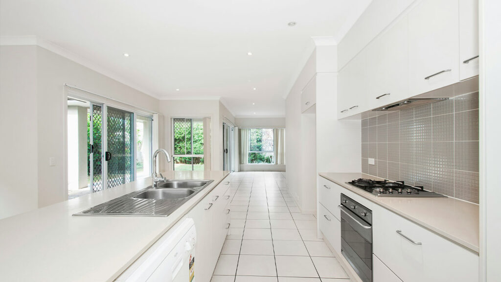 white wooden kitchen cupboards