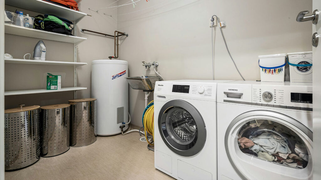 A laundry room with a washer and dryer