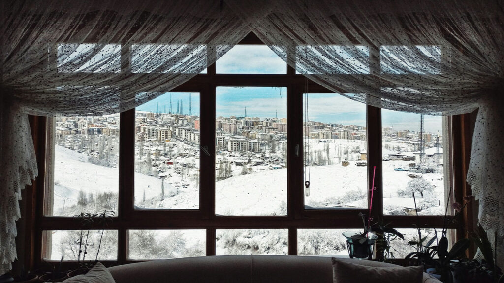 empty chair beside window