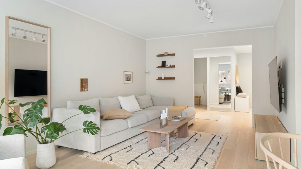 A living room filled with furniture and a flat screen TV