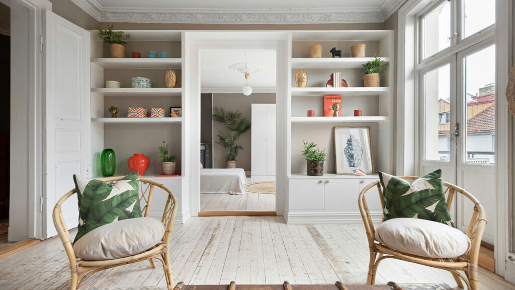 A living room filled with furniture and lots of windows