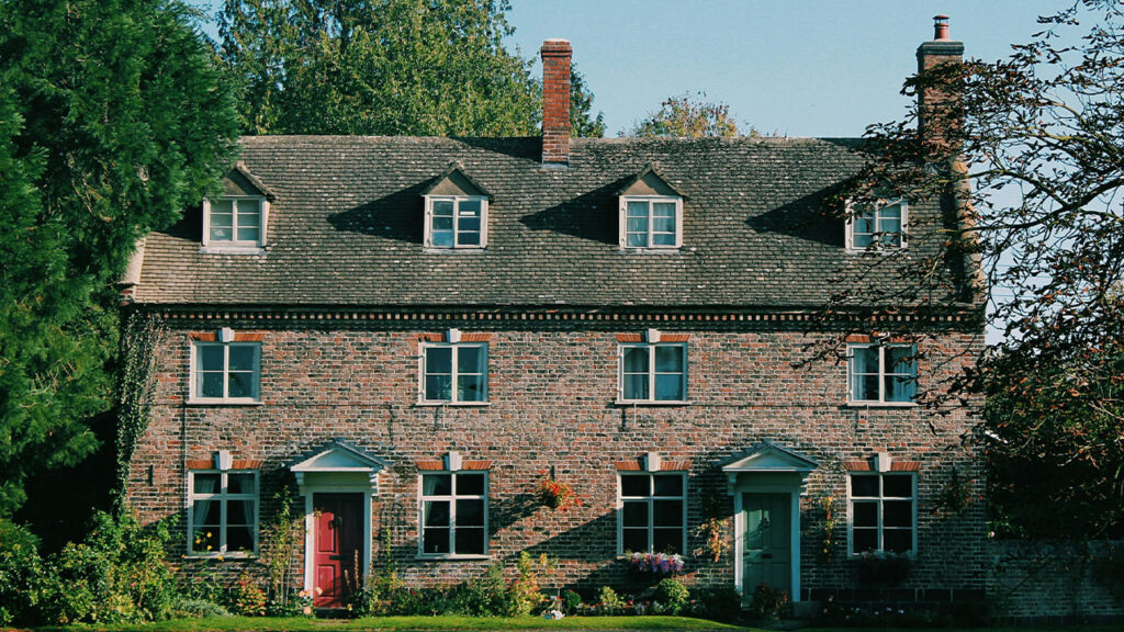 brown and green painted house
