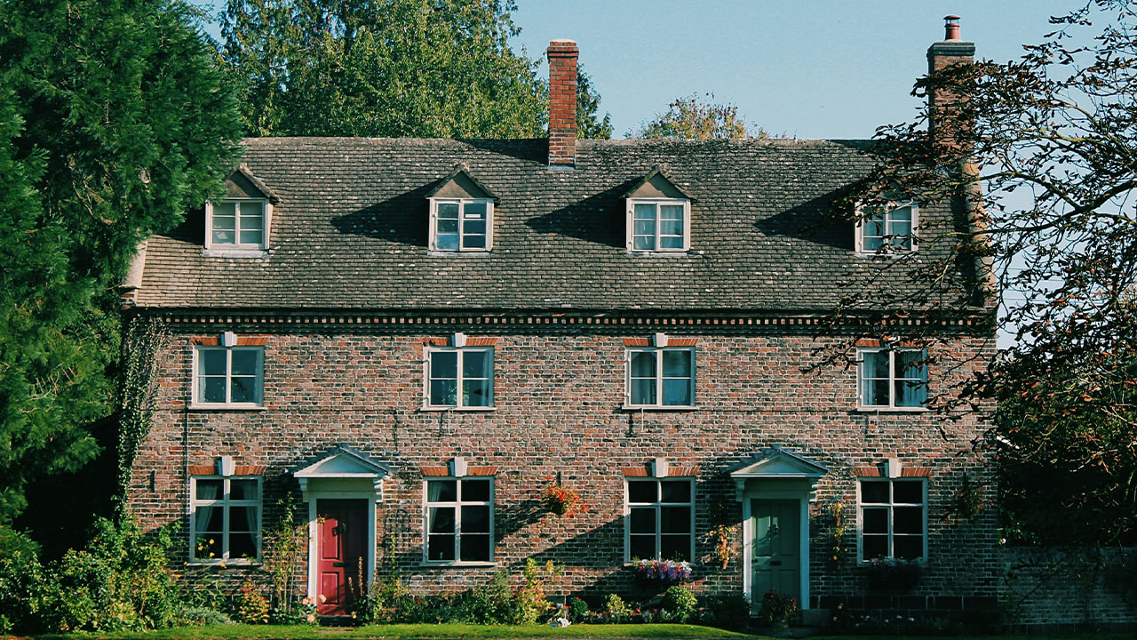 brown and green painted house