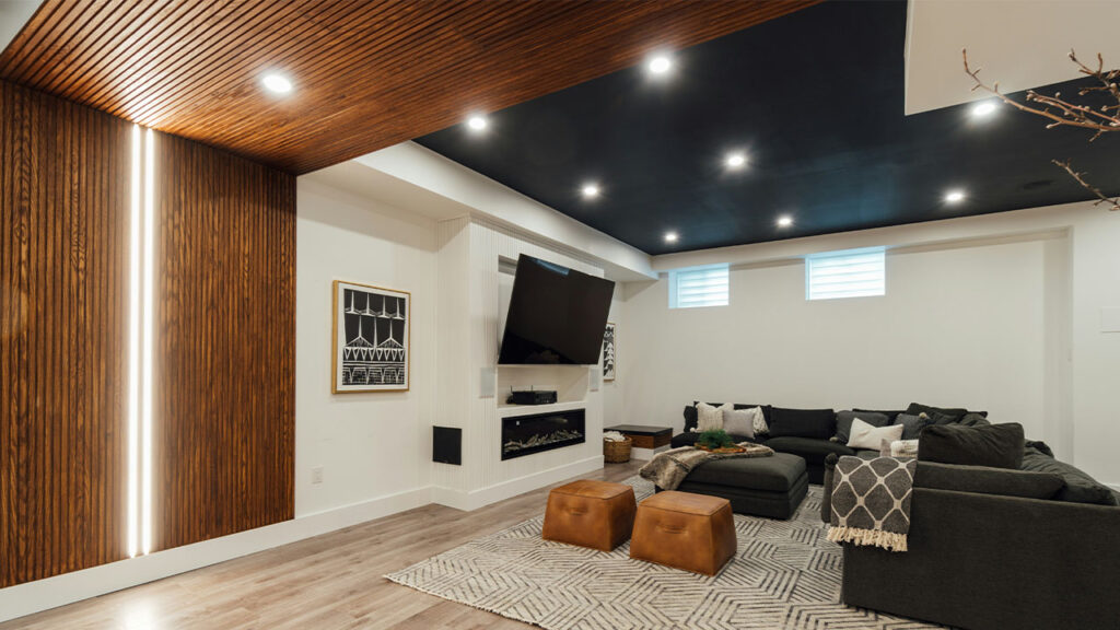 a living room with a couch a chair and a flat screen tv