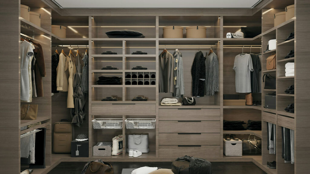 a walk in closet filled with lots of clothes