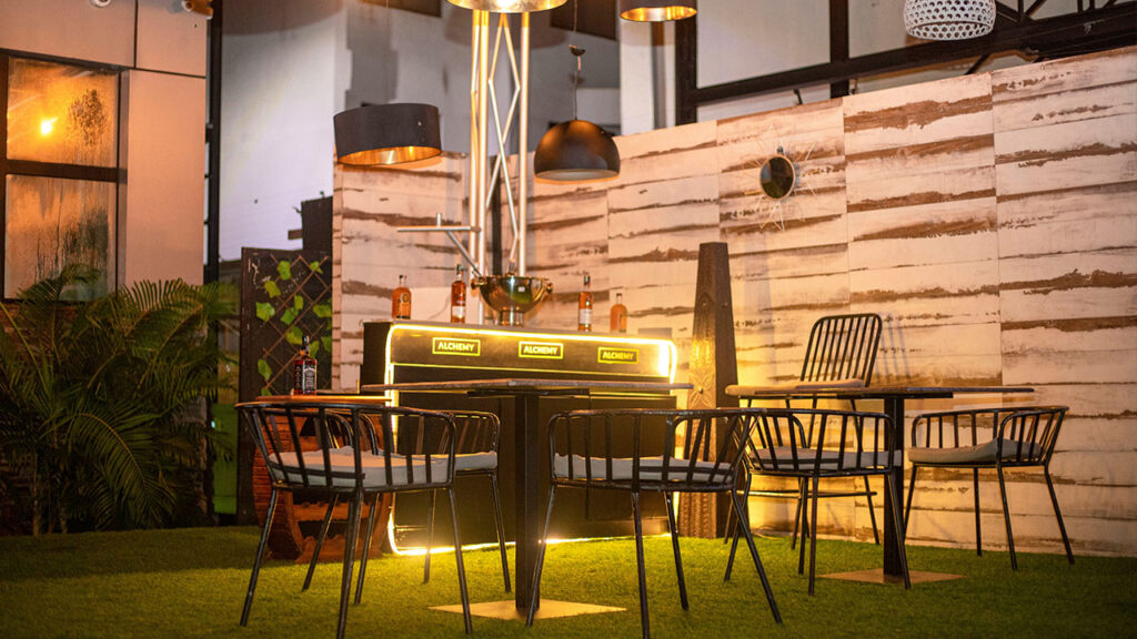 a table with chairs and a light