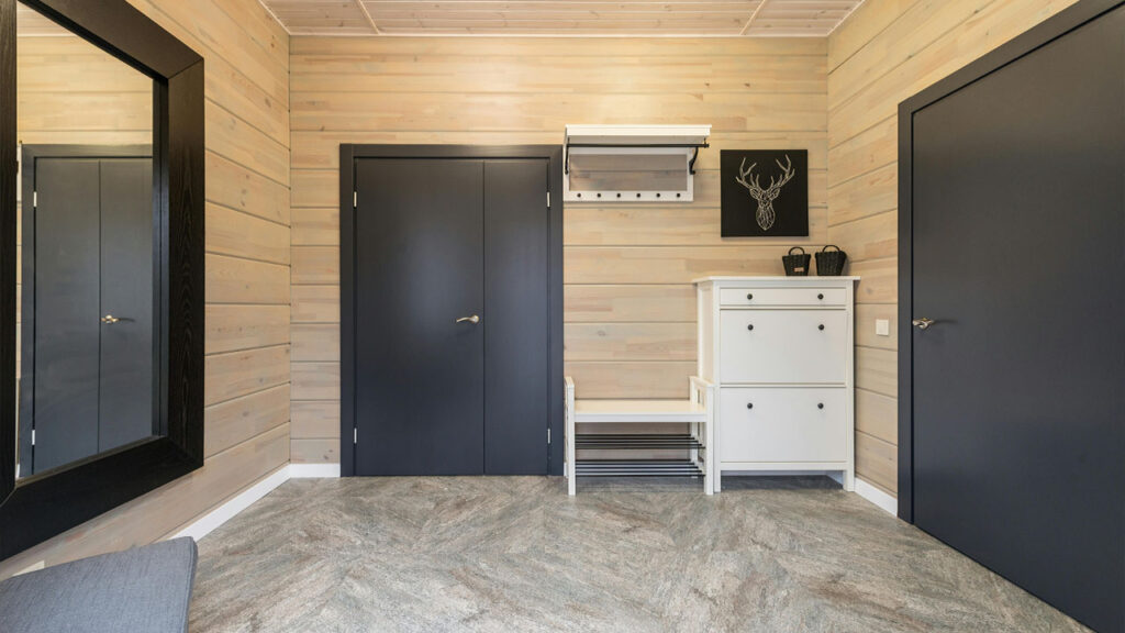Interior of corridor with doors near cupboard and mirror