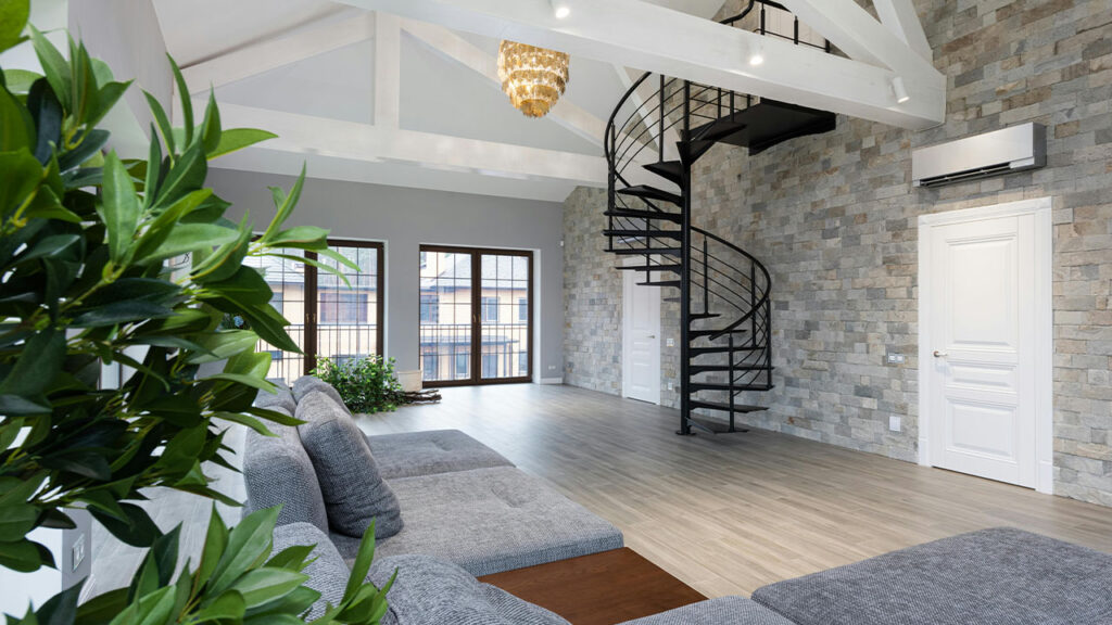 Spacious contemporary flat with green plants and spiral stairway