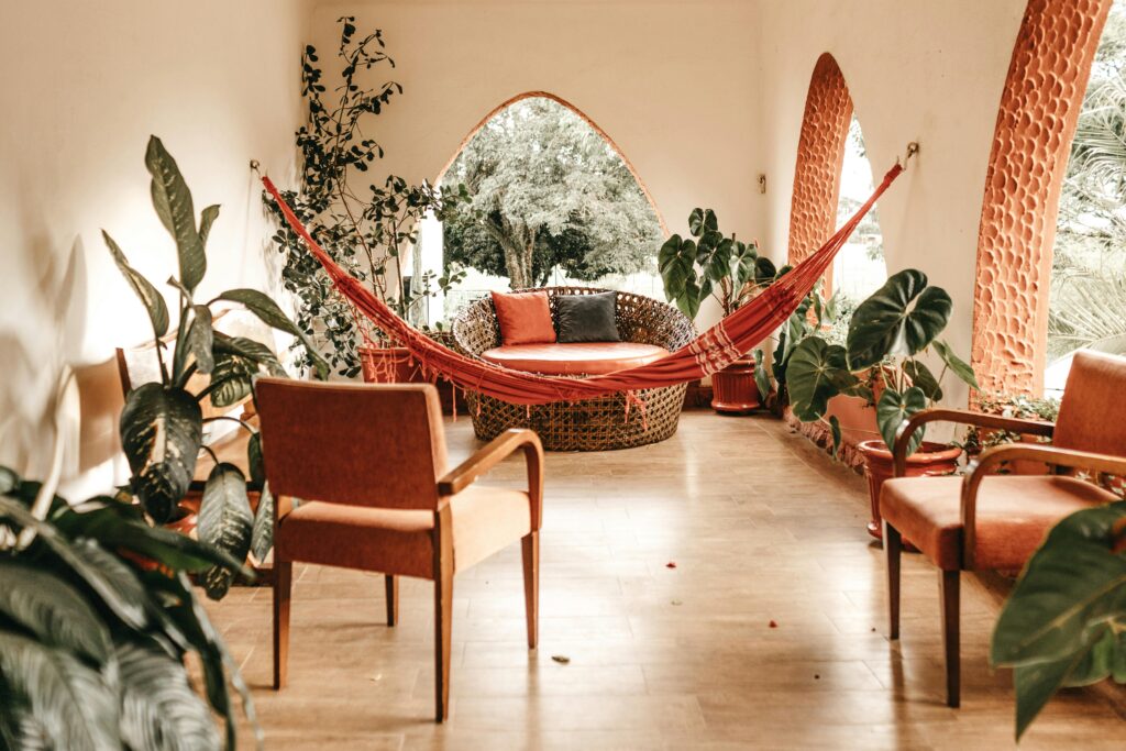 Jonathan Borba / Pexels A room with a hammock and chairs surrounded by plants