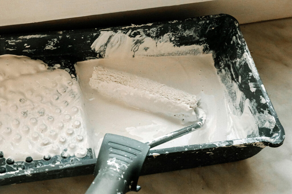 roller dipped in paint