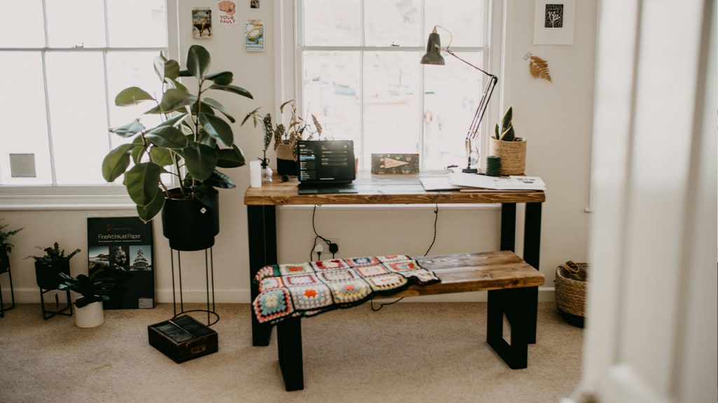 a room with a table and a bench in it