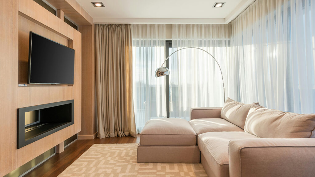Spacious living room with TV