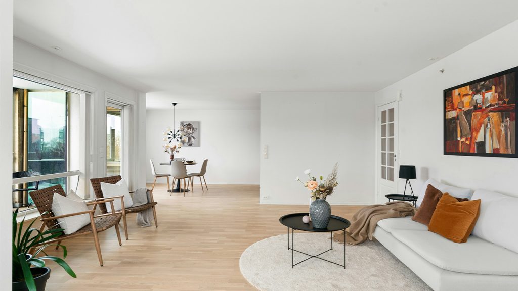 A living room filled with furniture and lots of windows
