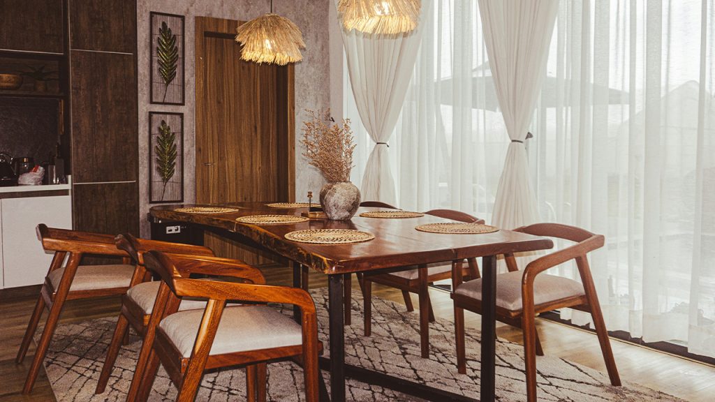 A dining room with a table and chairs