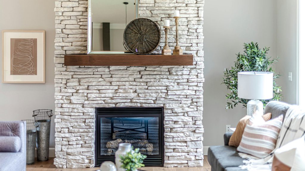black fireplace in brown brick wall