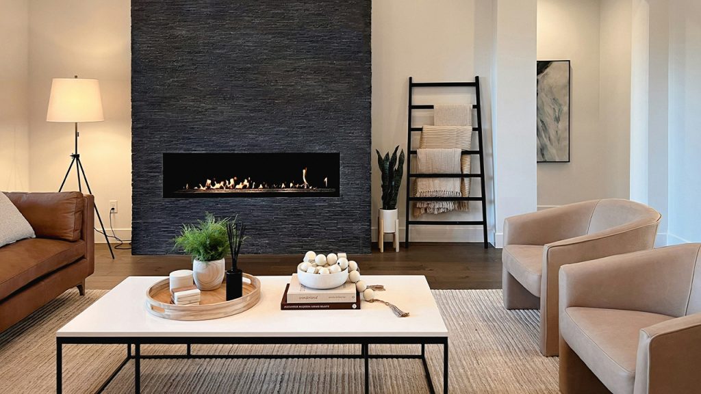 a living room filled with furniture and a fire place