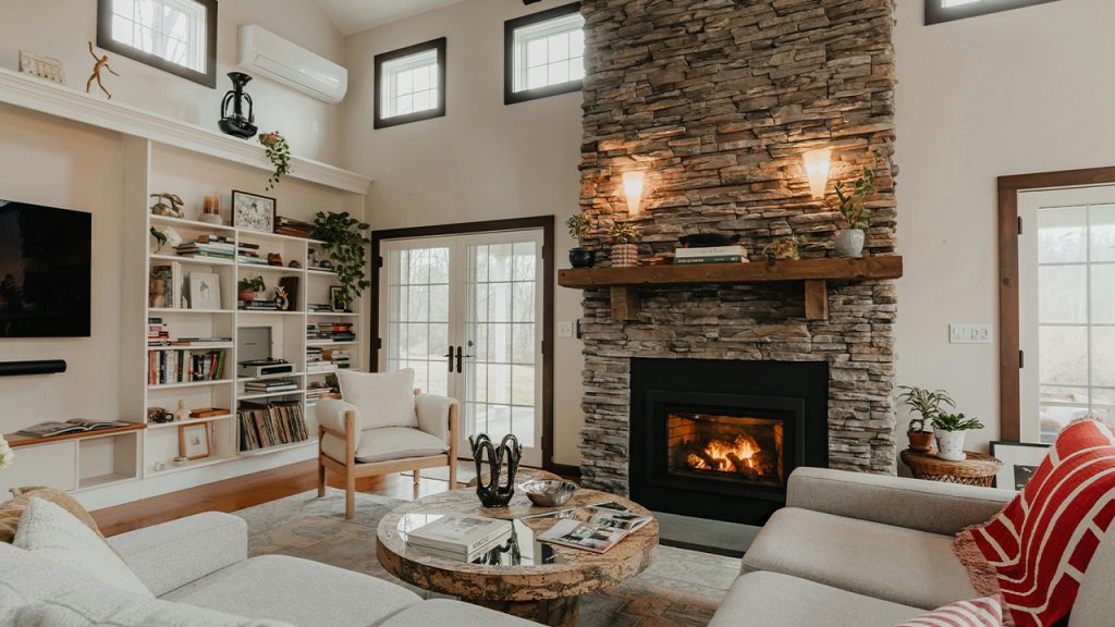 a living room filled with furniture and a fire place