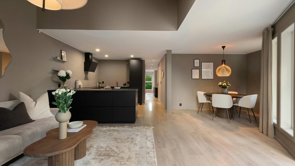 A living room filled with furniture and lots of windows