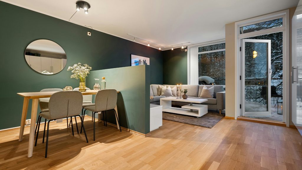 A living room filled with furniture and a wooden floor