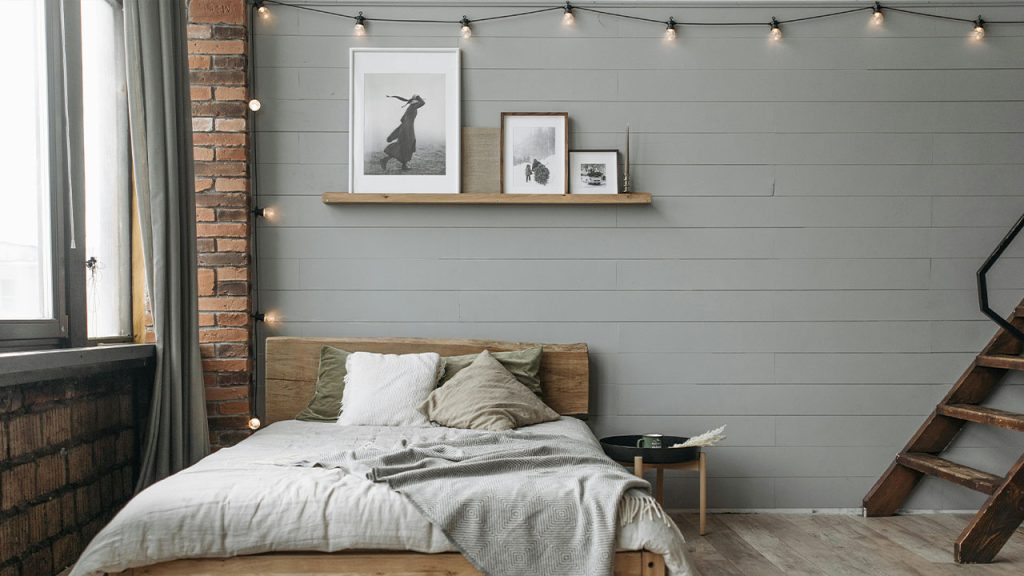 A Bedroom With Gray Walls and Wooden Floor