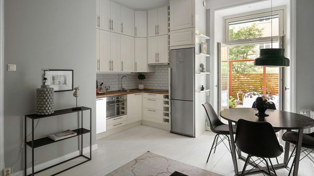 Modern Interior with White Cupboards and Black Chairs