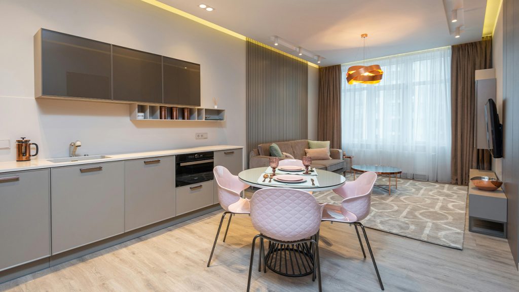 Contemporary living room with stylish kitchen zone