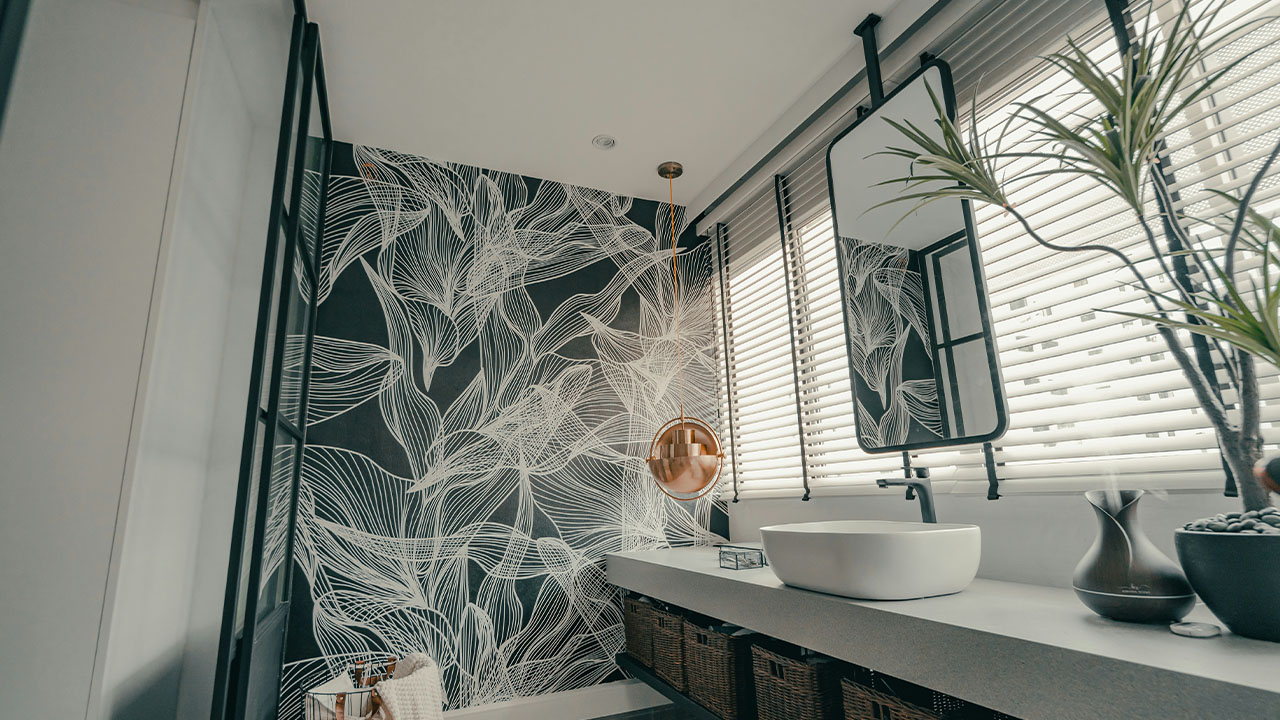 white ceramic sink near window