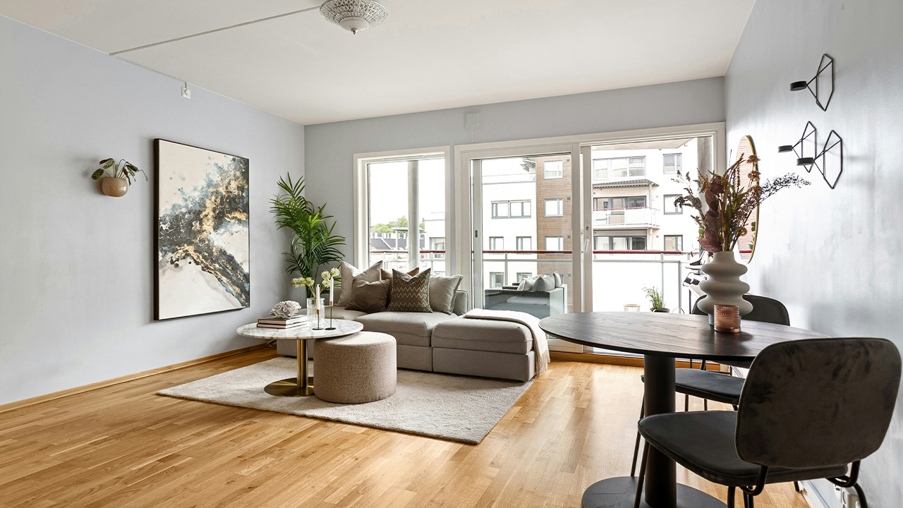 A living room filled with furniture and a wooden floor