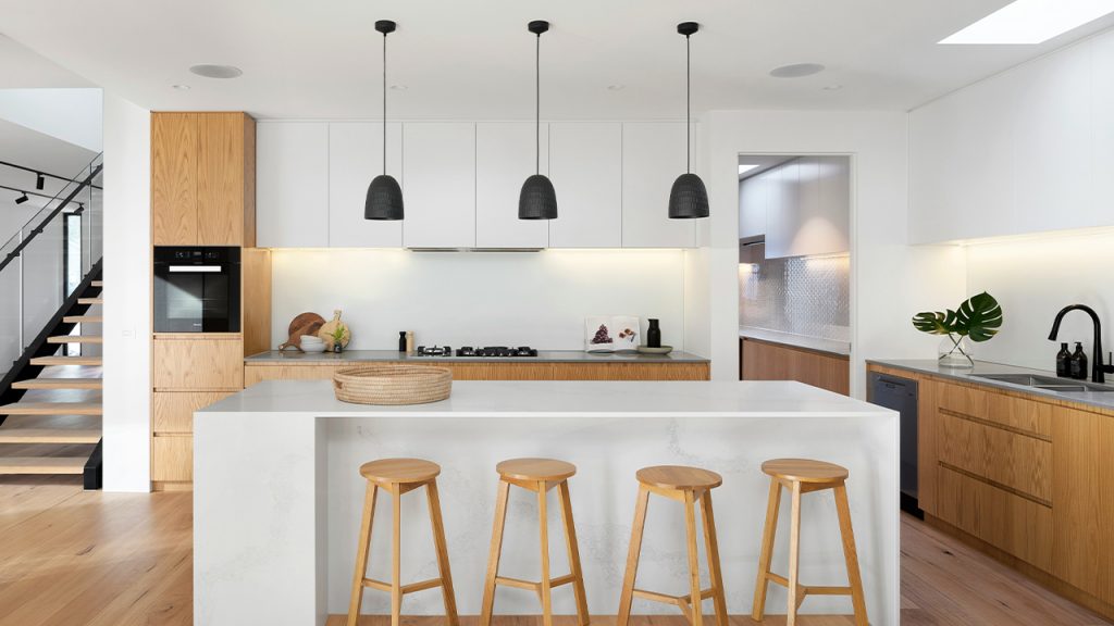 brown wooden seat beside white wooden table