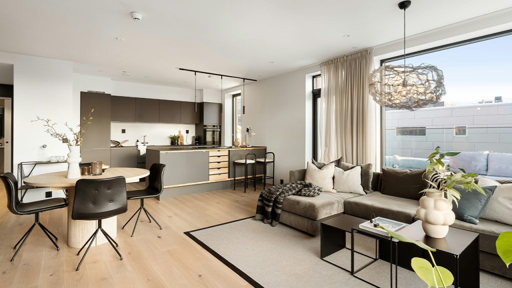 A living room filled with furniture and a large window